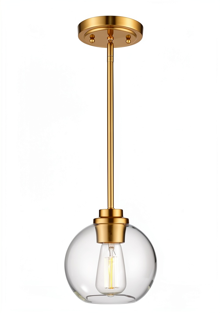 Pavo clear glass globe pendant light illuminating a modern kitchen