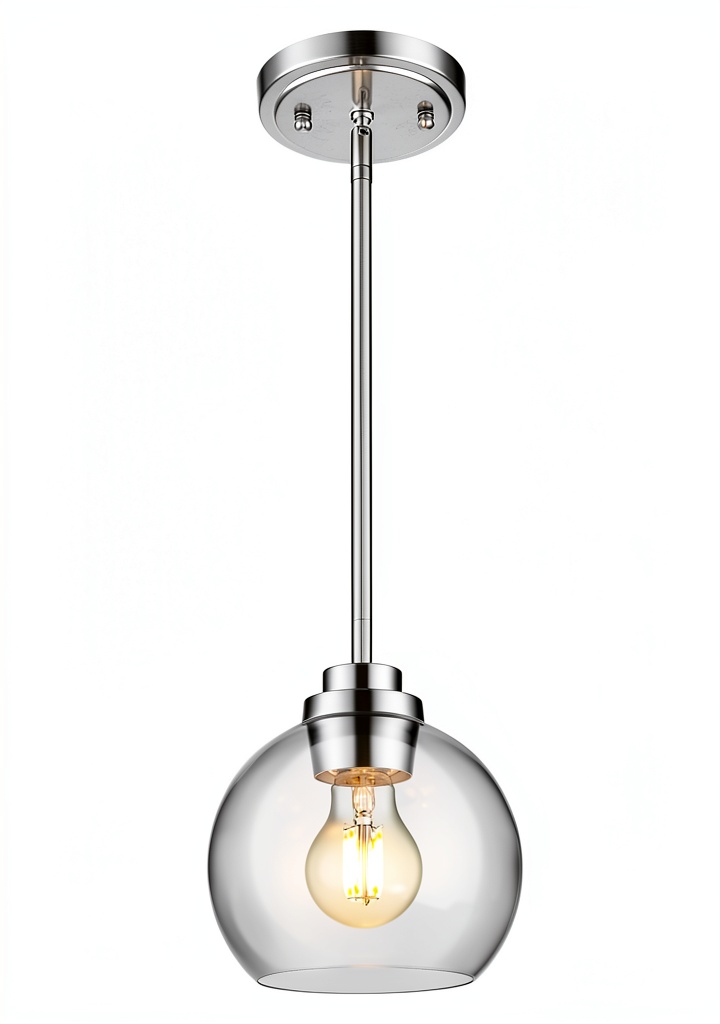 Pavo clear glass pendant light illuminating a modern kitchen island